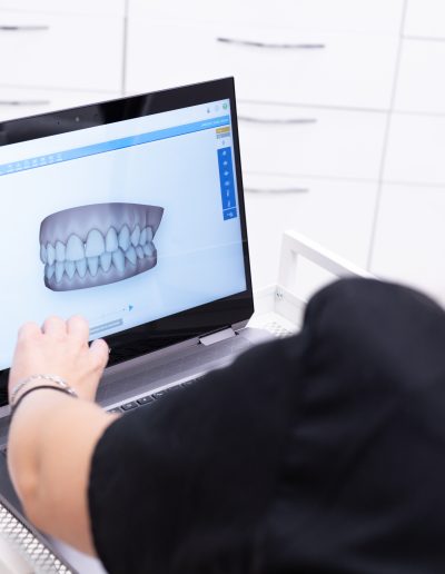 CJ Dental Studio Team looking at braces options.